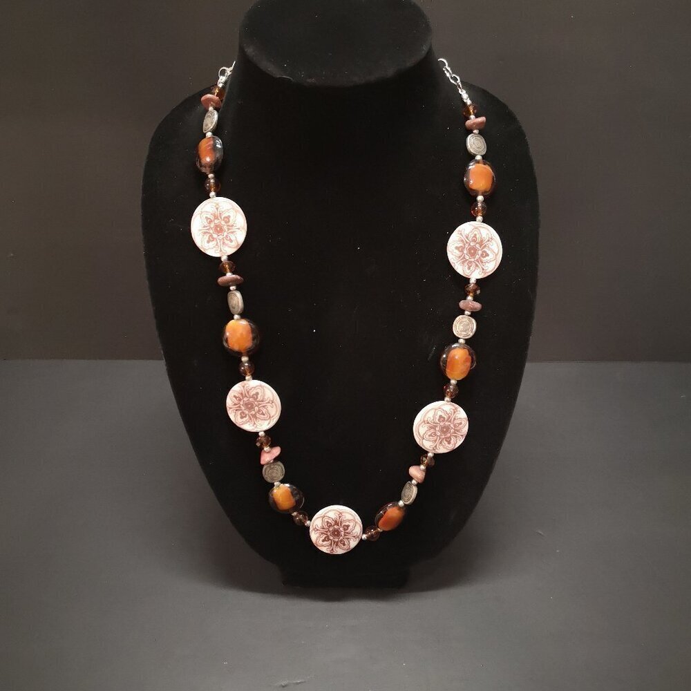 Necklace Featuring Brown Amber Patterned Beads & Silver Toned Metal Accents